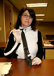 Carol Abraczinskas examines D.B. Cooper's tie in the FBI archive in Seattle, 2009.