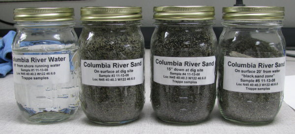 Jars of sand and water from the Columbia River used for experiments.
