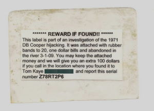 Fig. 2. Reward Tag bound to twenty, one dollar bills with a rubber band and deployed into the Washougal River on 3-2-2009. 
